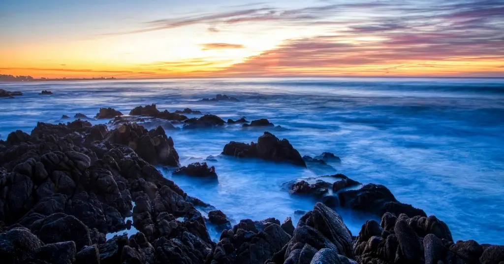 Long-exposure shot of the tide pools at Asilomar State Beach during sunset