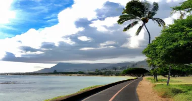 A bike path along the shore of Oahu with a storm approaching
